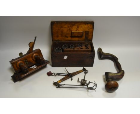 A late 19th century cased set of Avery scales with weights; a fine moulding plane, marked T.Graves; a brass drill
