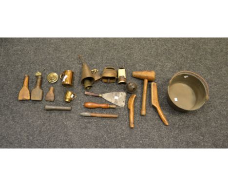 A  collection of Plumbers leadworking tools; a brass jam pan; a brass half pint measure ; various brass bells; a set of brass