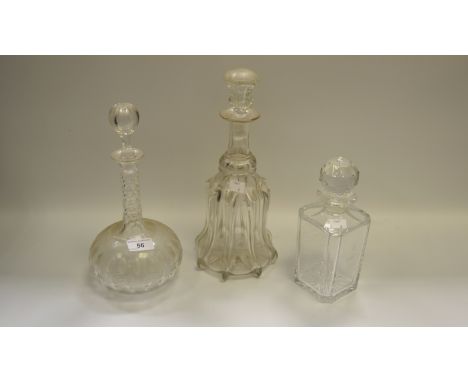 A Victorian mallet shaped decanter; an early 20th century globe and shaft decanter; another (3)