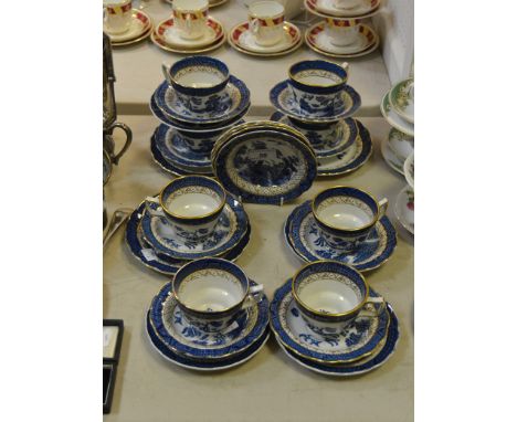 A Booths 'Real Old Willow' part tea service, comprising eight teacups, five saucers, four side plates, three dessert plates, 
