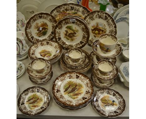 A comprehensive Palissy Game Series pattern dinner service comprising of ; meat plate, dinner plates; side plates, bowls , cu