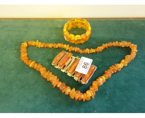 3 x amber coloured items of jewellery, a bangle, necklace and a bracelet,