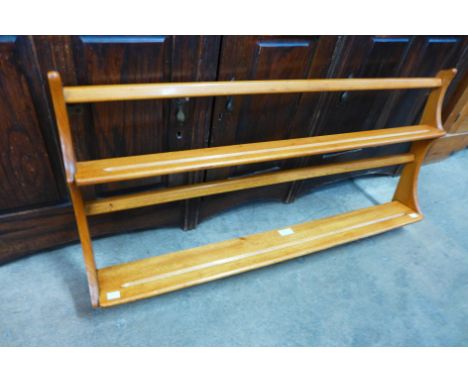 An Ercol elm plate rack 