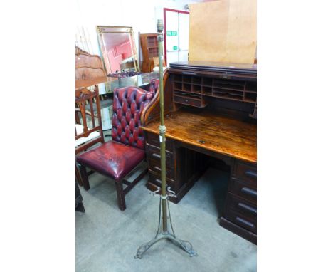 An Arts and Crafts brass telescopic floor standing lamp 