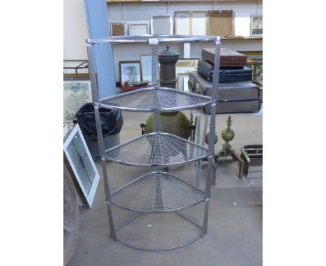 A chrome four tier corner shelf 