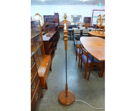 A teak standard lamp 