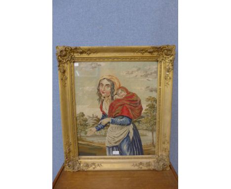 A Victorian woolwork tapestry, gypsy mother and child, framed 