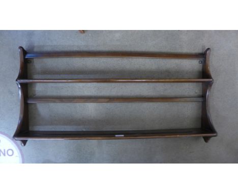 An Ercol Golden Dawn elm wall hanging plate rack 