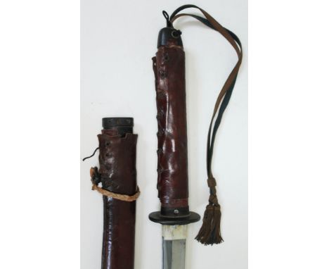 A Japanese WWII officer's katana with bound fish skin grip black lacquered scabbard and leather cover, length 100.5cm.  