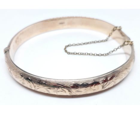 A hallmarked 9ct gold bangle, diam. approx. 57mm, wt. 10.9g.  