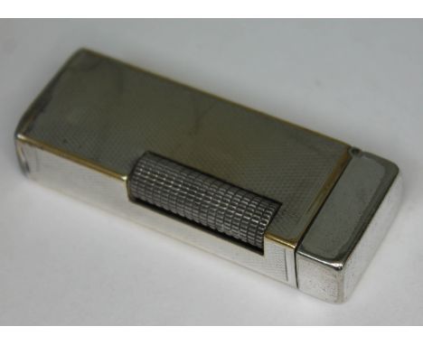 A Dunhill silver plated lighter.  