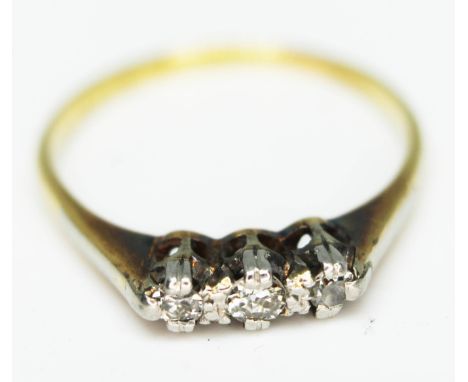 A three stone diamond ring, band marked '434', gross wt. 2.1g, size M.  