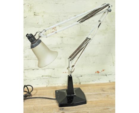 An early 20th century anglepoise lamp with cast metal base, white arm and glass shade.  