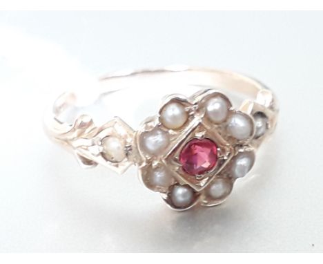 An 18ct gold ruby and half cut pearl cluster ring, marked '18K', gross wt. 2.4g, size L.Condition: 1 possible replacement pea
