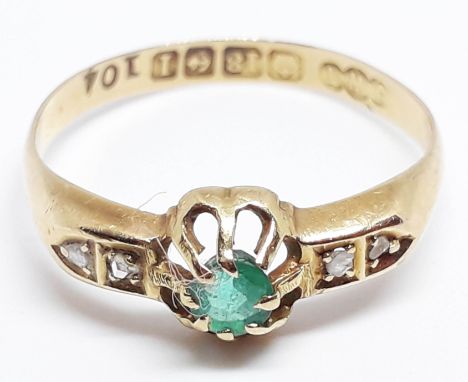 A hallmarked 18ct gold diamond emerald ring, gross wt. 1.9g, size N.  