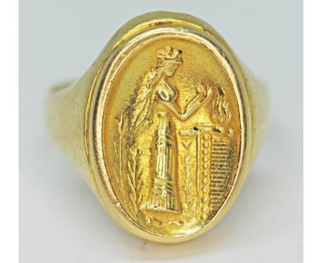 A Georgian style gold insignia type signet ring, indistinctly marked '750', gross wt. 9.5g, size R/S.  