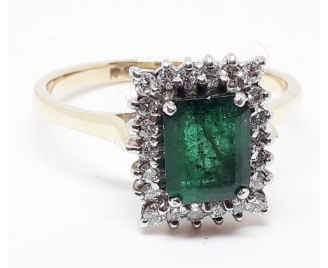 An 18ct gold diamond emerald cluster ring, band marked '18ct', gross wt. 5.9g, size Z.