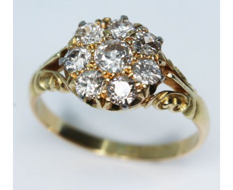 A late Victorian diamond cluster ring featuring eight old cut diamonds, cluster diam. 10mm, hallmarked 18ct gold, gross wt. 4