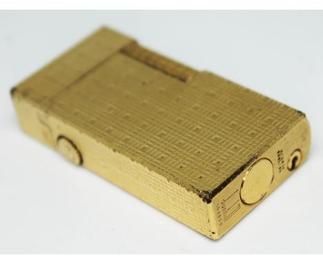 A gold plated Dunhill lighter.  
