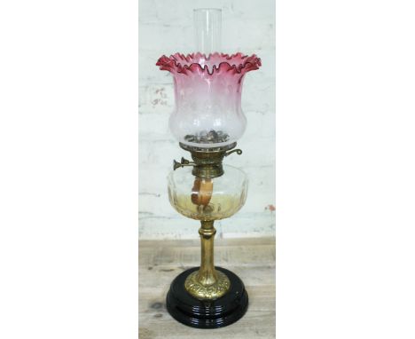 A Victorian brass column oil lamp with cut glass reservoir, pot base and etched glass shade, height 562cm.Condition: no signs