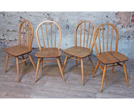 A set of four Ercol blonde elm and beech chairs.  