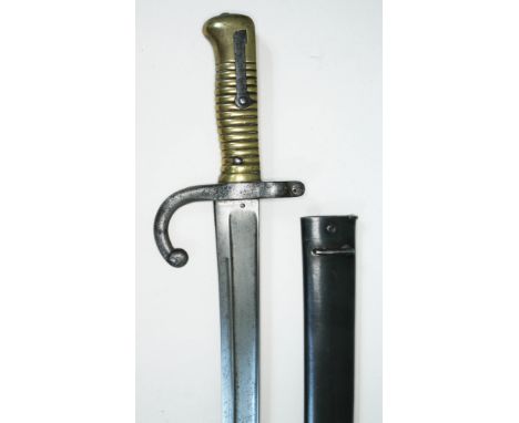 A French 19th century bayonet and scabbard, length 71cm.  