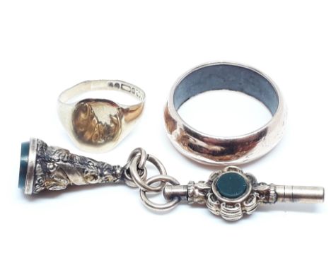 A mixed lot comprising a hallmarked 9ct gold signet ring wt. 1.1g, another ring unmarked, a seal fob and fob key both set wit