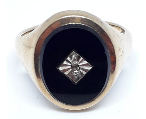 A hallmarked 9ct gold black onyx and diamond signet ring, gross wt. 6.2g, size Q/R.  