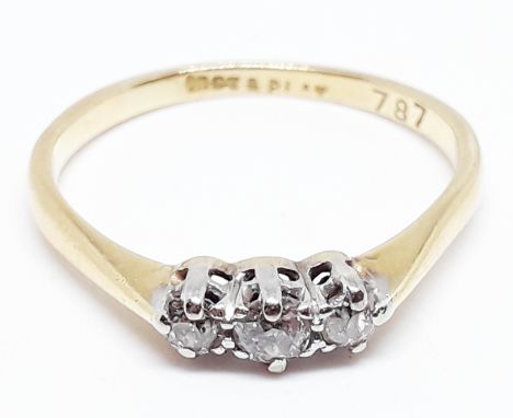 An 18ct gold three stone diamond ring, marked '18ct PT', gross wt. 2.3g, size P.  