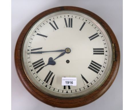 Oak cased circular wall clock, the painted 10in dial with Roman numerals and single train fusee movement, 12.5ins overall dia