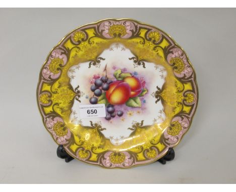 Royal Worcester cabinet plate, painted with fruits by R. Lewis, within a yellow, pink and gilt border, 9ins diameterSome mino