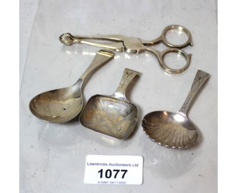 Two antique silver caddy spoons (marks indistinct), together with a later Birmingham silver caddy spoon and a pair of silver 