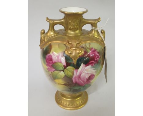 Royal Worcester two handled baluster form pedestal vase, painted with red roses by R. Austin, date code for 1920, 7.75ins hig