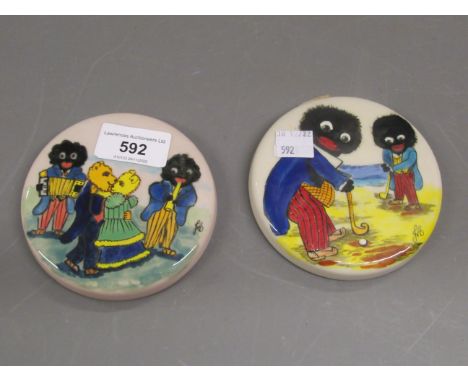 Joan Allen, pair of small circular wall plaques, unmarked, painted with gollies playing golf and golly band and teddy dancers