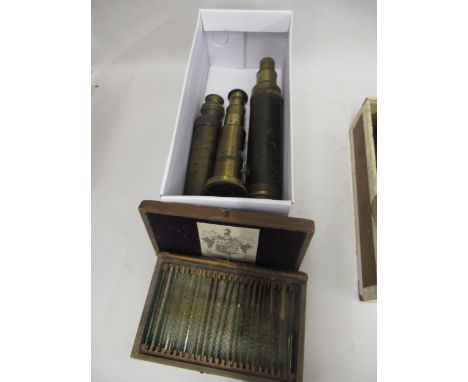 Brass field microscope with single lens, two telescopes (both at fault), and a box containing a collection of slides, includi