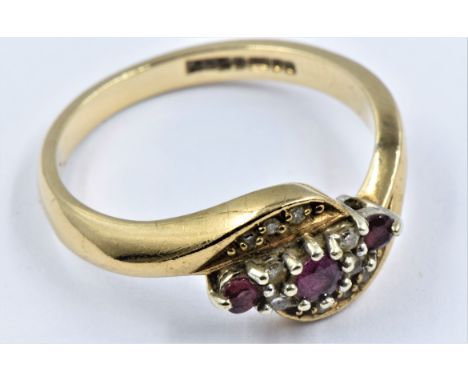 Yellow gold ruby and diamond crossover ring, size 'O' 