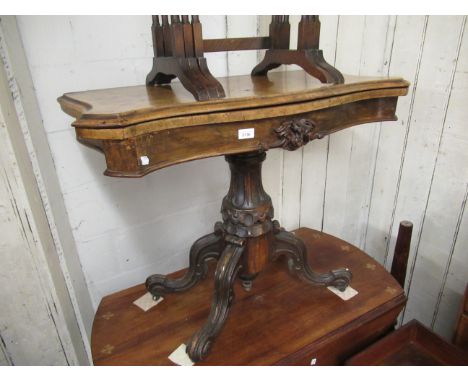 19th Century serpentine fronted burr walnut card table with carved column support and four cabriole legs with casters, 30ins 