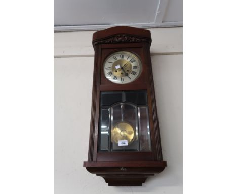 20th Century walnut cased Vienna style wall clock, the circular silvered dial with Roman numerals, the three train  movement 