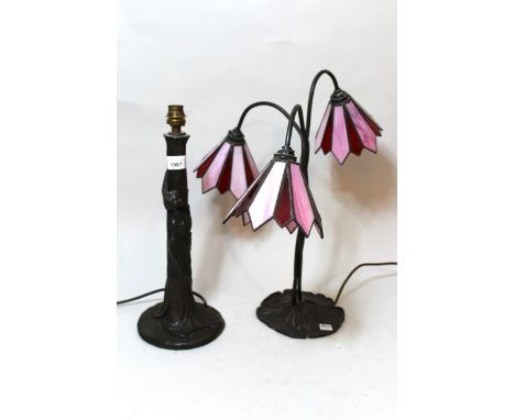 Art Nouveau style bronzed composition table lamp with leaded glass shade (shade at fault), together with another similar and 