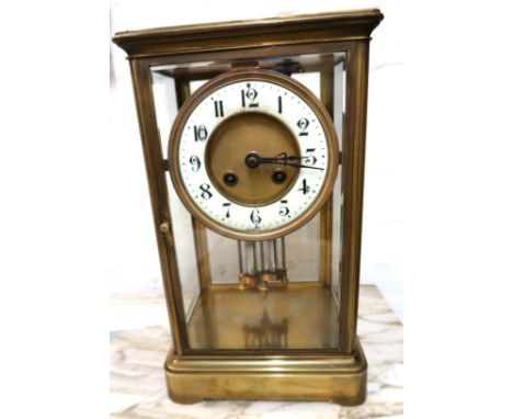 Early 20th Century gilt brass cased four glass library clock, the circular dial with white chapter ring with Arabic numerals,