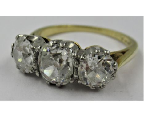 18ct Gold and platinum three stone old cut diamond ring, the centre stone of approximately 0.5ct, flanked by two slightly sma