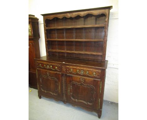 18th Century French oak dresser with boarded shelf back above two drawers and two shaped panel doors, 59ins x 19.5ins x 79ins