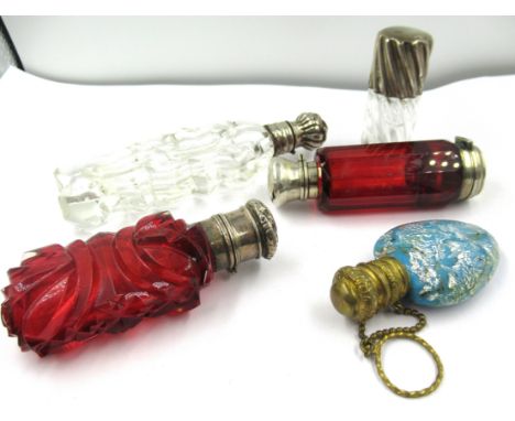 19th Century ruby glass double-ended scent bottle / vinaigrette, together with four other various scent bottles (at fault) 