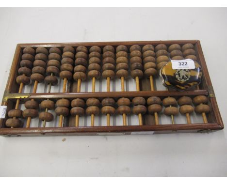 Small tortoiseshell covered purse with leather interior and an abacus 