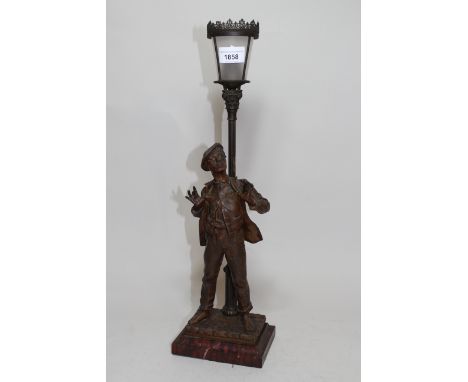 Early 20th Century French spelter patinated figure of a young boy with cap, beneath a lamppost on a marble base and a table l