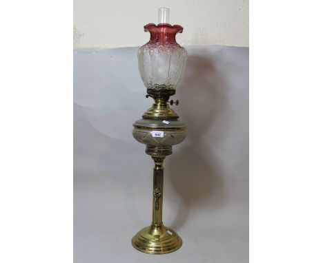 Large Early 20th Century gilt brass oil lamp with cranberry glass shade 