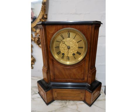 Continental walnut cased mantel clock having circular dial with two train movement striking on gongs 