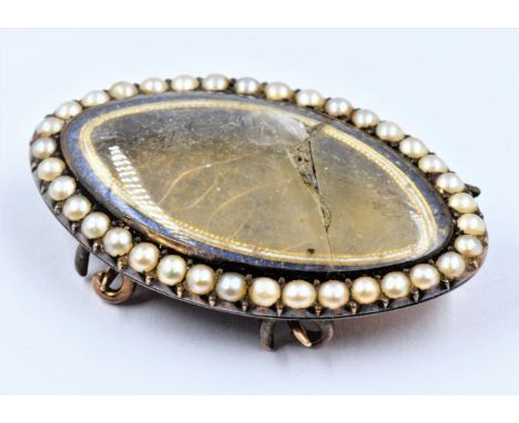 Georgian yellow metal blue enamel and split seed pearl set mourning brooch with double pin fastening (at fault) 