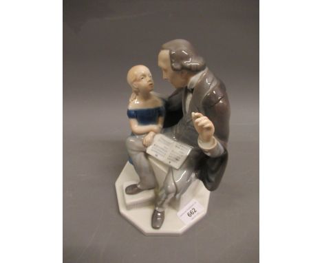 Royal Copenhagen figure of a schoolmaster, with a little girl on an octagonal base, 9ins highIn good condition. No damages. 