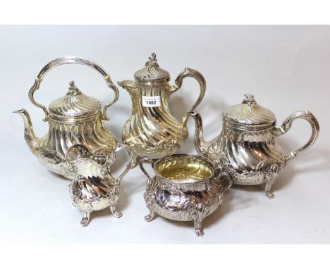 Late 19th Century Scottish silver tea service comprising:  teapot, hot water pot, cream jug and sugar basin, Edinburgh 1890 /